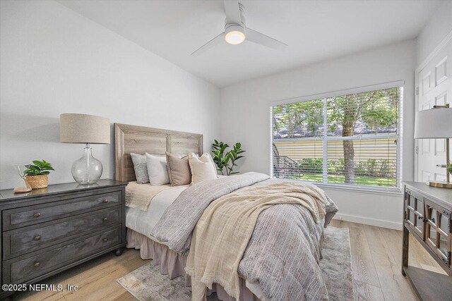 1800 The Greens Way Unit 1907, Jacksonville Beach, FL 32250 - bedroom featuring light wood finished floors, ceiling fan, and baseboards