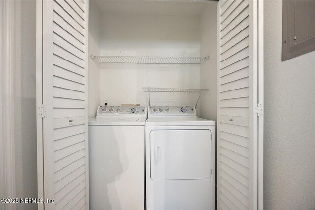 1800 The Greens Way Unit 1907, Jacksonville Beach, FL 32250 - laundry area with washing machine and clothes dryer and electric panel