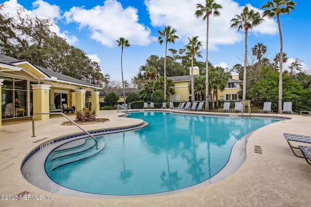 1800 The Greens Way Unit 1907, Jacksonville Beach, FL 32250 - community pool with a patio