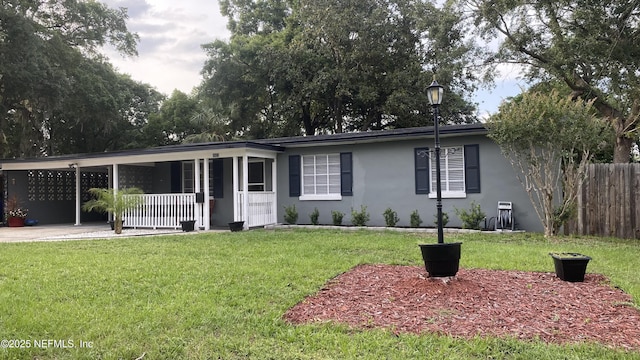 5923 Green Hill Ln, Jacksonville, FL 32211 - ranch-style house with stucco siding, an attached carport, and a porch