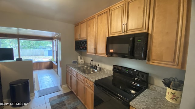 5923 Green Hill Ln, Jacksonville, FL 32211 - kitchen with black appliances, a sink, and light tile patterned floors