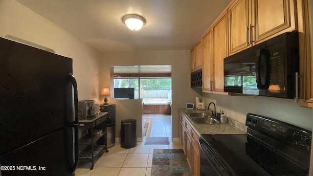 5923 Green Hill Ln, Jacksonville, FL 32211 - kitchen featuring black appliances, a sink, and light tile patterned floors
