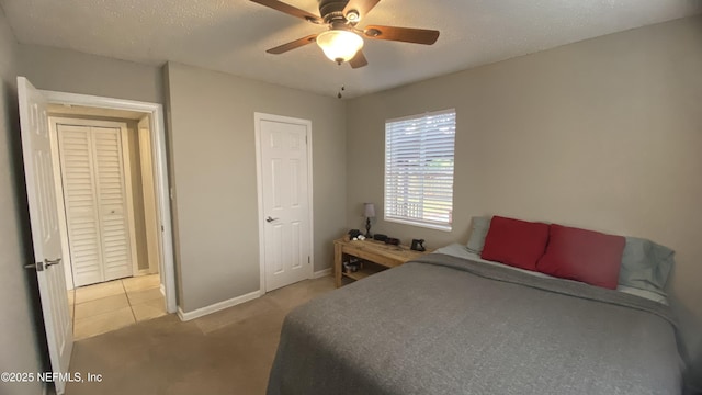 5923 Green Hill Ln, Jacksonville, FL 32211 - bedroom with baseboards, light colored carpet, ceiling fan, and a textured ceiling