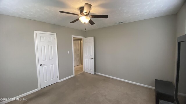 5923 Green Hill Ln, Jacksonville, FL 32211 - unfurnished bedroom with baseboards, carpet flooring, and ceiling fan