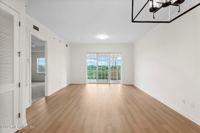 150 Pantano Cay Blvd Unit 2303, Saint Augustine, FL 32080 - spare room featuring ornamental molding, light wood-style flooring, plenty of natural light, and ceiling fan