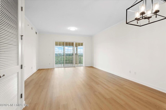 150 Pantano Cay Blvd Unit 2303, Saint Augustine, FL 32080 - unfurnished dining area featuring a chandelier, light wood finished floors, and crown molding