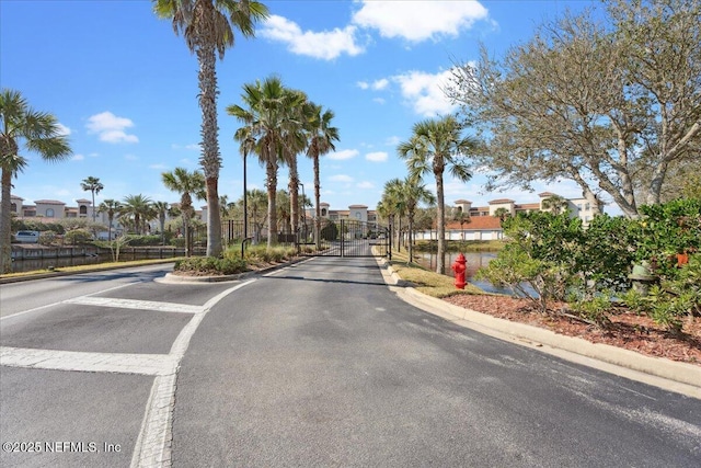 150 Pantano Cay Blvd Unit 2303, Saint Augustine, FL 32080 - view of asphalt street with curbs, a gate, a residential view, and a gated entry