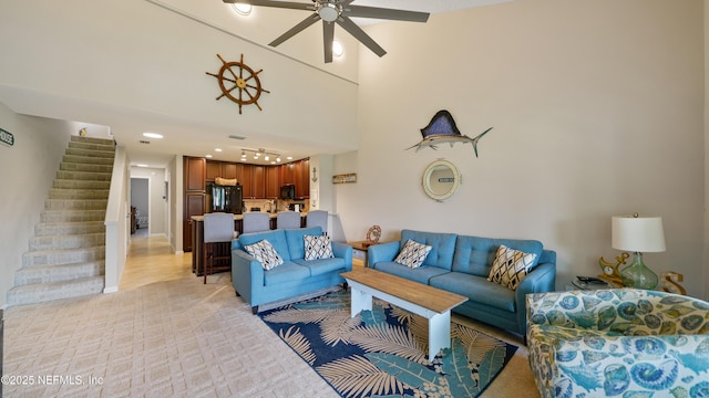 87 Village Del Lago Cir, Saint Augustine, FL 32080 - living room with stairs, a ceiling fan, recessed lighting, and a high ceiling