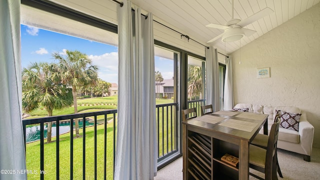 87 Village Del Lago Cir, Saint Augustine, FL 32080 - sunroom featuring a textured wall, lofted ceiling, and carpet floors
