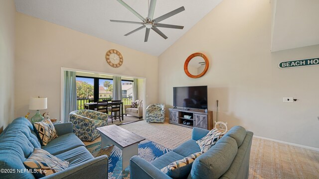 87 Village Del Lago Cir, Saint Augustine, FL 32080 - carpeted living room featuring high vaulted ceiling, a ceiling fan, and baseboards