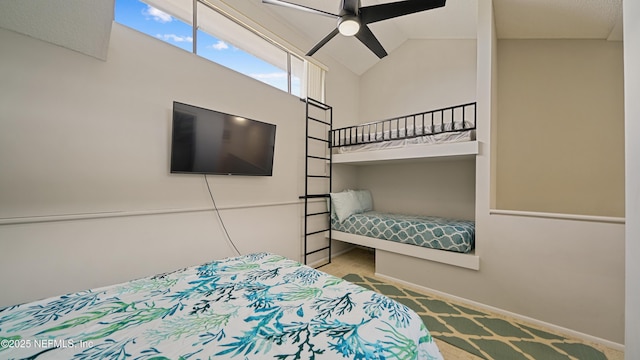 87 Village Del Lago Cir, Saint Augustine, FL 32080 - carpeted bedroom with baseboards, ceiling fan, and high vaulted ceiling