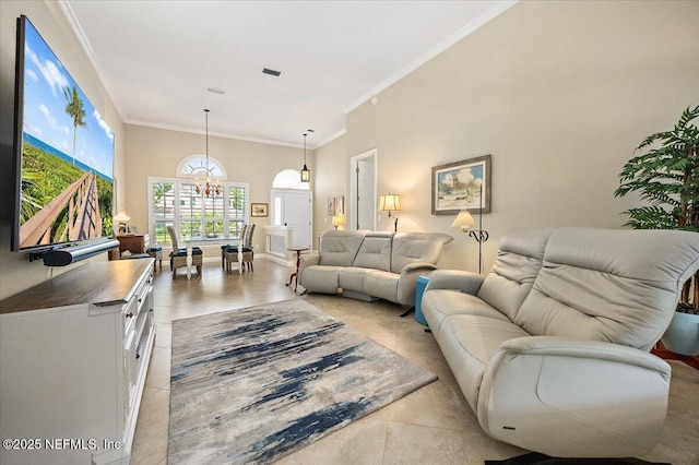 6541 Burnham Cir, Ponte Vedra Beach, FL 32082 - living area featuring a chandelier, crown molding, and light tile patterned flooring