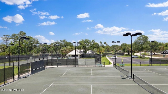 6541 Burnham Cir, Ponte Vedra Beach, FL 32082 - view of tennis court with view of scattered trees