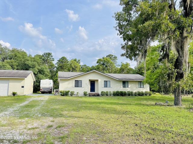 417 2nd Ave, Satsuma, FL 32189 - ranch-style home featuring a front lawn and metal roof
