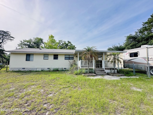 417 2nd Ave, Satsuma, FL 32189 - view of front facade featuring crawl space, a porch, and metal roof