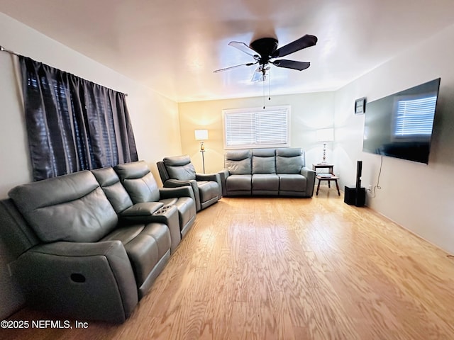 417 2nd Ave, Satsuma, FL 32189 - living room with light wood-style floors, ceiling fan, and healthy amount of natural light