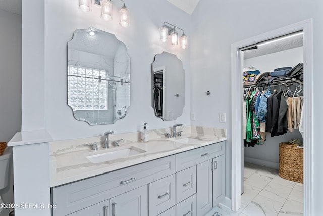 1321 Honeysuckle Dr, Saint Johns, FL 32259 - full bathroom with marble finish floors, double vanity, a walk in closet, and a shower