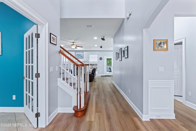 1321 Honeysuckle Dr, Saint Johns, FL 32259 - hallway featuring wood finished floors, stairs, and baseboards