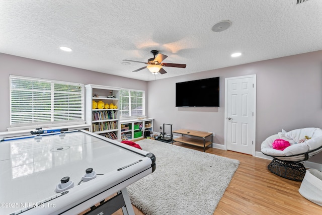 1321 Honeysuckle Dr, Saint Johns, FL 32259 - recreation room with ceiling fan, light wood-style flooring, a textured ceiling, recessed lighting, and baseboards
