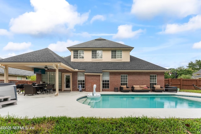 1321 Honeysuckle Dr, Saint Johns, FL 32259 - back of house featuring outdoor lounge area, a fenced backyard, a patio, brick siding, and a hot tub