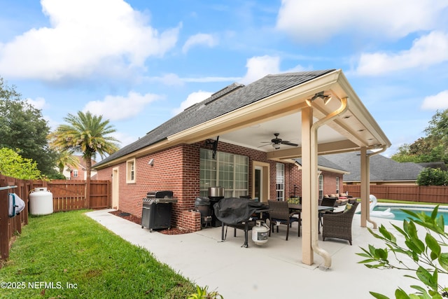1321 Honeysuckle Dr, Saint Johns, FL 32259 - rear view of property with a ceiling fan, a patio, brick siding, and a shingled roof