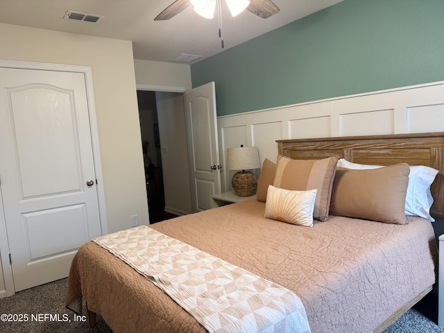 126 Falcon Ridge Rd, Saint Augustine, FL 32084 - bedroom featuring wainscoting, a decorative wall, carpet floors, and a ceiling fan