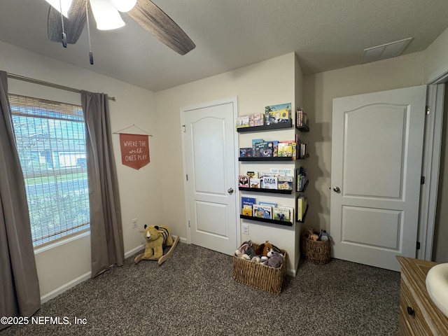 126 Falcon Ridge Rd, Saint Augustine, FL 32084 - carpeted bedroom featuring baseboards and ceiling fan