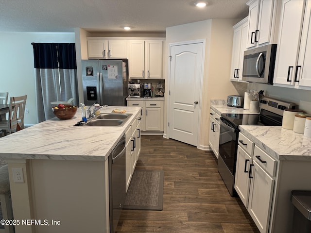 126 Falcon Ridge Rd, Saint Augustine, FL 32084 - kitchen featuring stainless steel appliances, dark wood-style flooring, light countertops, white cabinetry, and recessed lighting