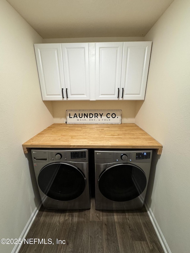 126 Falcon Ridge Rd, Saint Augustine, FL 32084 - washroom featuring cabinet space, washing machine and dryer, and dark wood finished floors