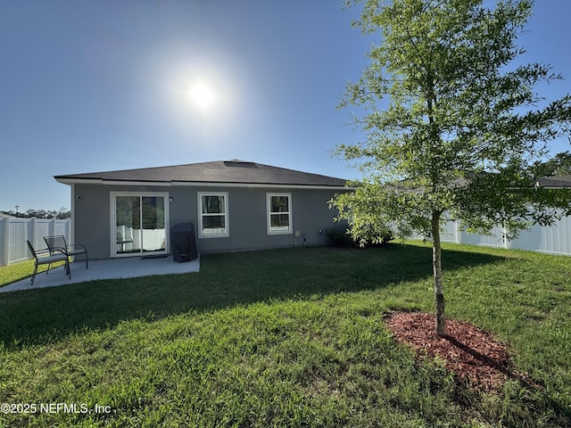 126 Falcon Ridge Rd, Saint Augustine, FL 32084 - back of property featuring a patio and stucco siding