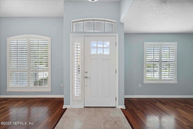 8681 Canopy Oaks Dr, Jacksonville, FL 32256 - entryway with hardwood / wood-style floors, plenty of natural light, and baseboards