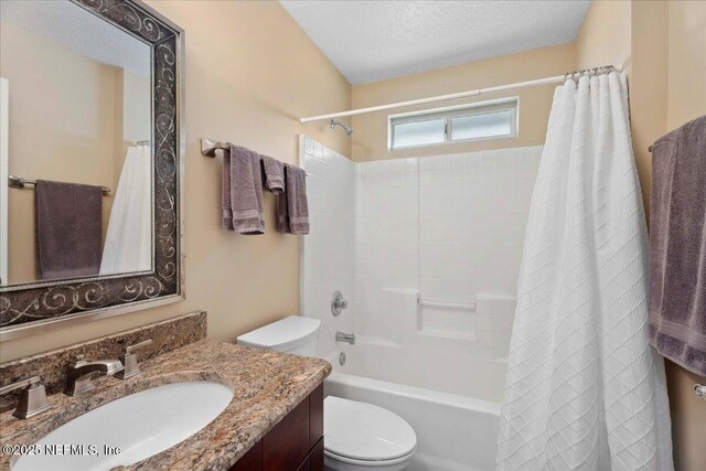 8681 Canopy Oaks Dr, Jacksonville, FL 32256 - bathroom featuring toilet, shower / bath combo, vanity, and a textured ceiling