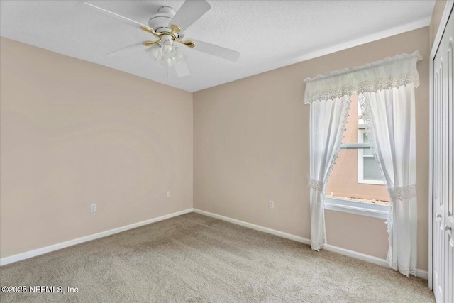 8681 Canopy Oaks Dr, Jacksonville, FL 32256 - carpeted empty room with a ceiling fan and baseboards