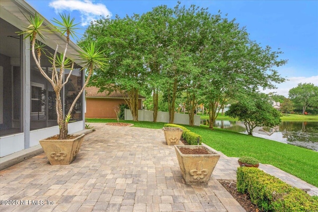 8681 Canopy Oaks Dr, Jacksonville, FL 32256 - view of patio / terrace featuring a water view and a sunroom