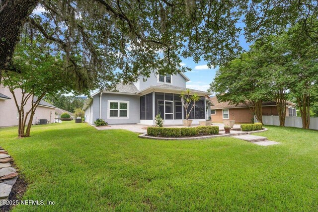 8681 Canopy Oaks Dr, Jacksonville, FL 32256 - back of house featuring a sunroom, stucco siding, and central air condition unit