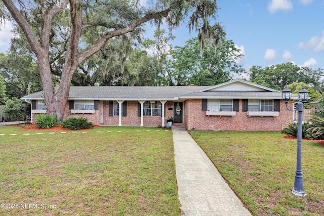 2620 Shenandoah Dr S, Orange Park, FL 32073 - single story home featuring a front lawn, brick siding, and a shingled roof