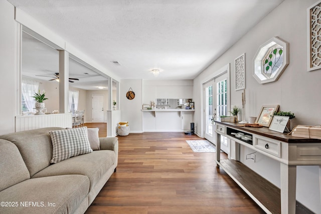 2620 Shenandoah Dr S, Orange Park, FL 32073 - living area with wood finished floors, a ceiling fan, and baseboards