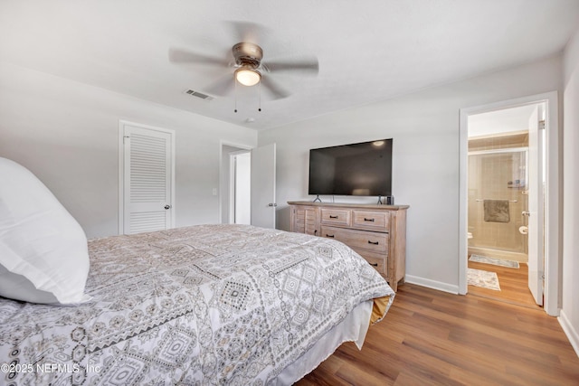 2620 Shenandoah Dr S, Orange Park, FL 32073 - bedroom featuring wood finished floors, baseboards, ceiling fan, ensuite bathroom, and a closet