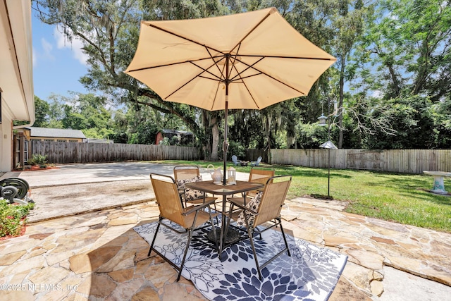 2620 Shenandoah Dr S, Orange Park, FL 32073 - view of patio / terrace featuring outdoor dining space and view of wooded area