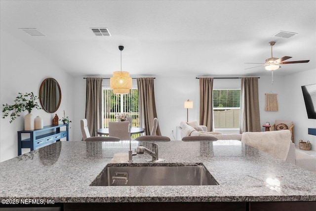 1976 Red Loop, Lakeland, FL 33801 - kitchen featuring a sink, open floor plan, healthy amount of natural light, and ceiling fan