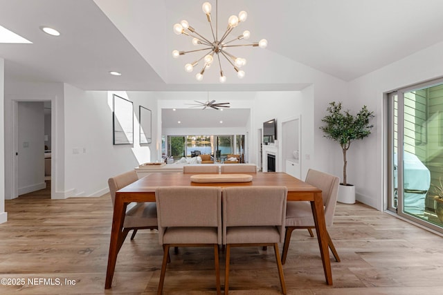 1 Lake Julia Dr S, Ponte Vedra Beach, FL 32082 - dining room with a chandelier, light wood-style flooring, vaulted ceiling, and recessed lighting