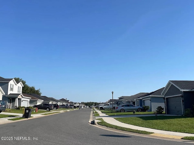 7202 Victoria Rd, Lakeland, FL 33809 - view of asphalt street with a residential view, sidewalks, street lighting, and curbs