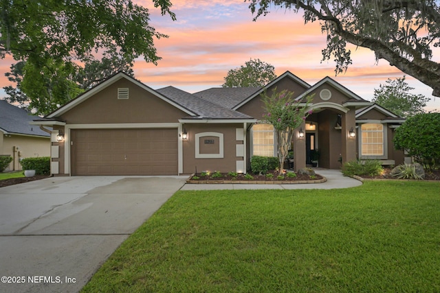 1823 Sentry Oak Ct, Fleming Island, FL 32003 - ranch-style house featuring stucco siding, concrete driveway, an attached garage, a front lawn, and a shingled roof