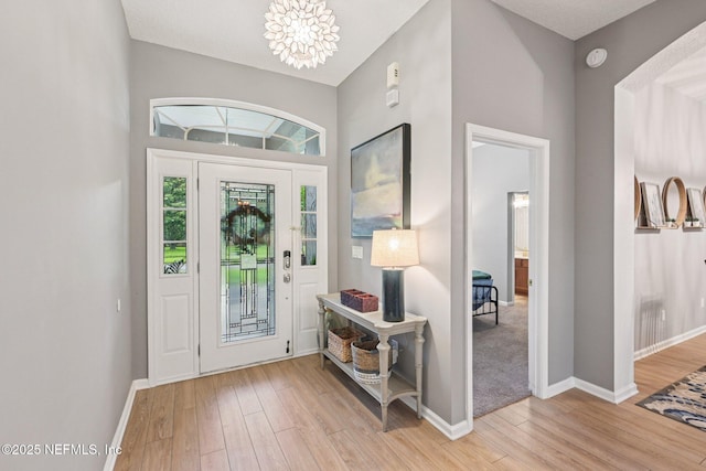 1823 Sentry Oak Ct, Fleming Island, FL 32003 - foyer entrance with wood finished floors, baseboards, and a chandelier