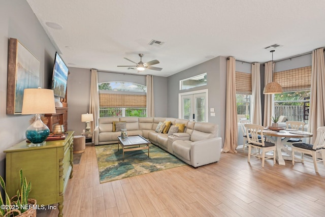 1823 Sentry Oak Ct, Fleming Island, FL 32003 - living area featuring ceiling fan, wood finished floors, a textured ceiling, and french doors