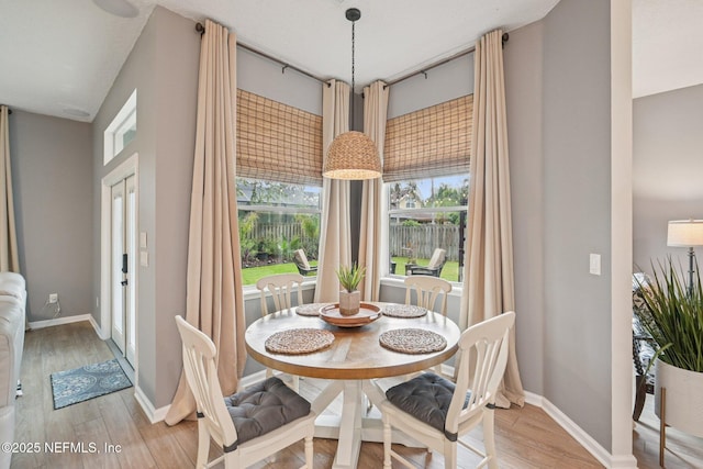 1823 Sentry Oak Ct, Fleming Island, FL 32003 - dining area with light wood-style flooring and baseboards