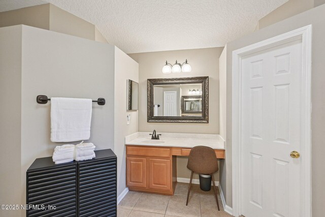 1823 Sentry Oak Ct, Fleming Island, FL 32003 - bathroom with tile patterned flooring, vanity, a textured ceiling, and baseboards