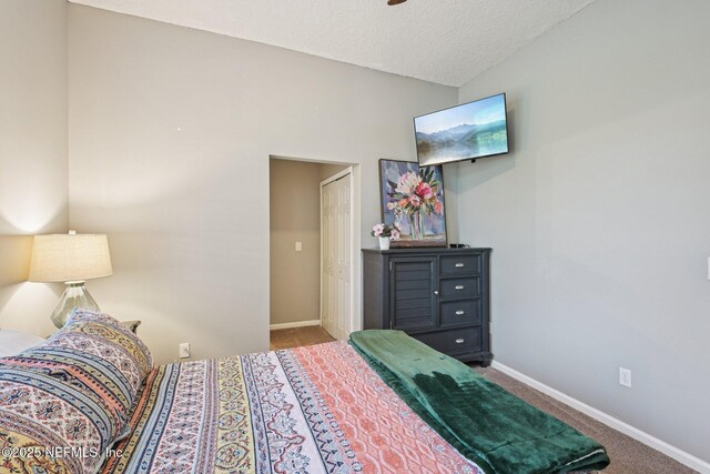 1823 Sentry Oak Ct, Fleming Island, FL 32003 - bedroom featuring baseboards, carpet flooring, and a textured ceiling
