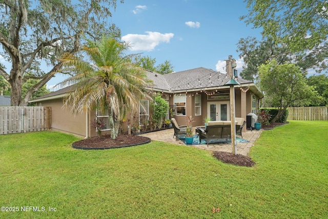 1823 Sentry Oak Ct, Fleming Island, FL 32003 - back of property featuring french doors, stucco siding, a patio area, an outdoor hangout area, and a chimney