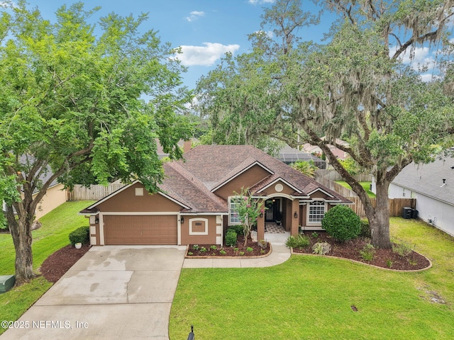 1823 Sentry Oak Ct, Fleming Island, FL 32003 - view of front of property featuring driveway, a garage, stucco siding, and a shingled roof
